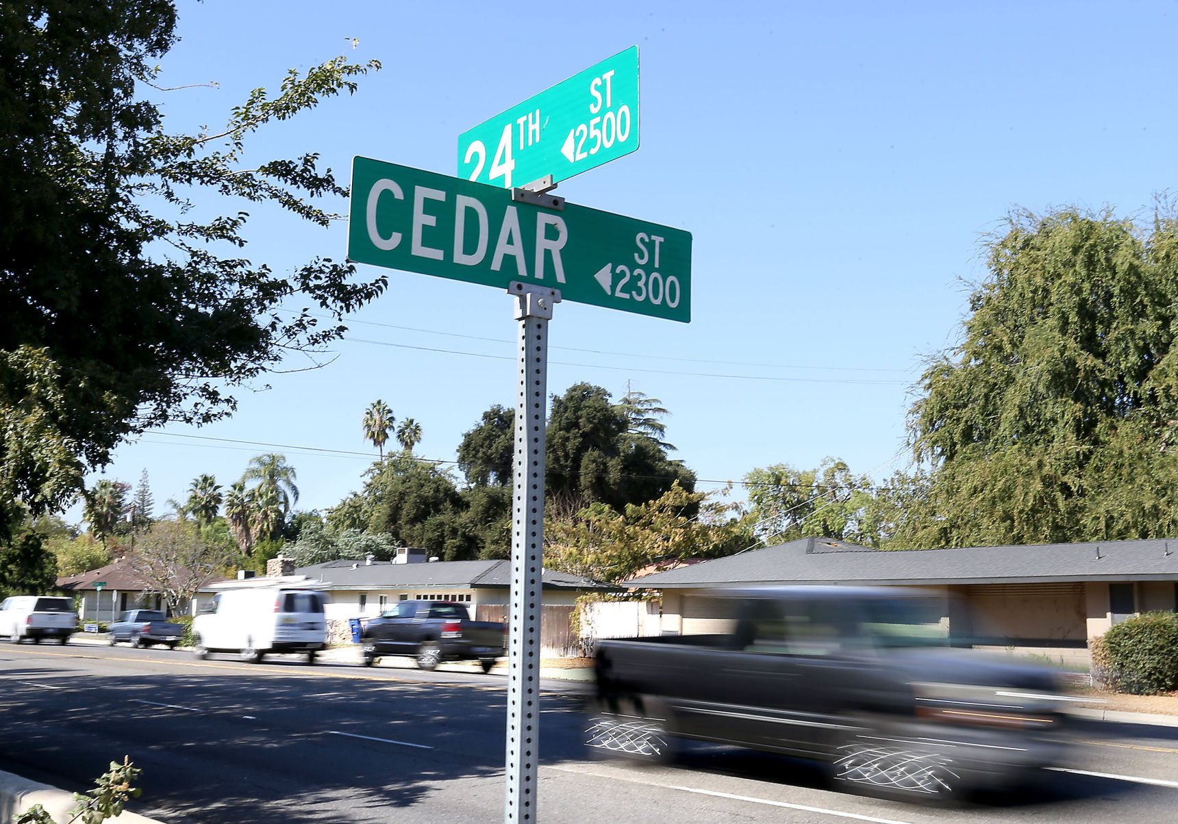 Drivers whiz along 24th Street at Cedar Street